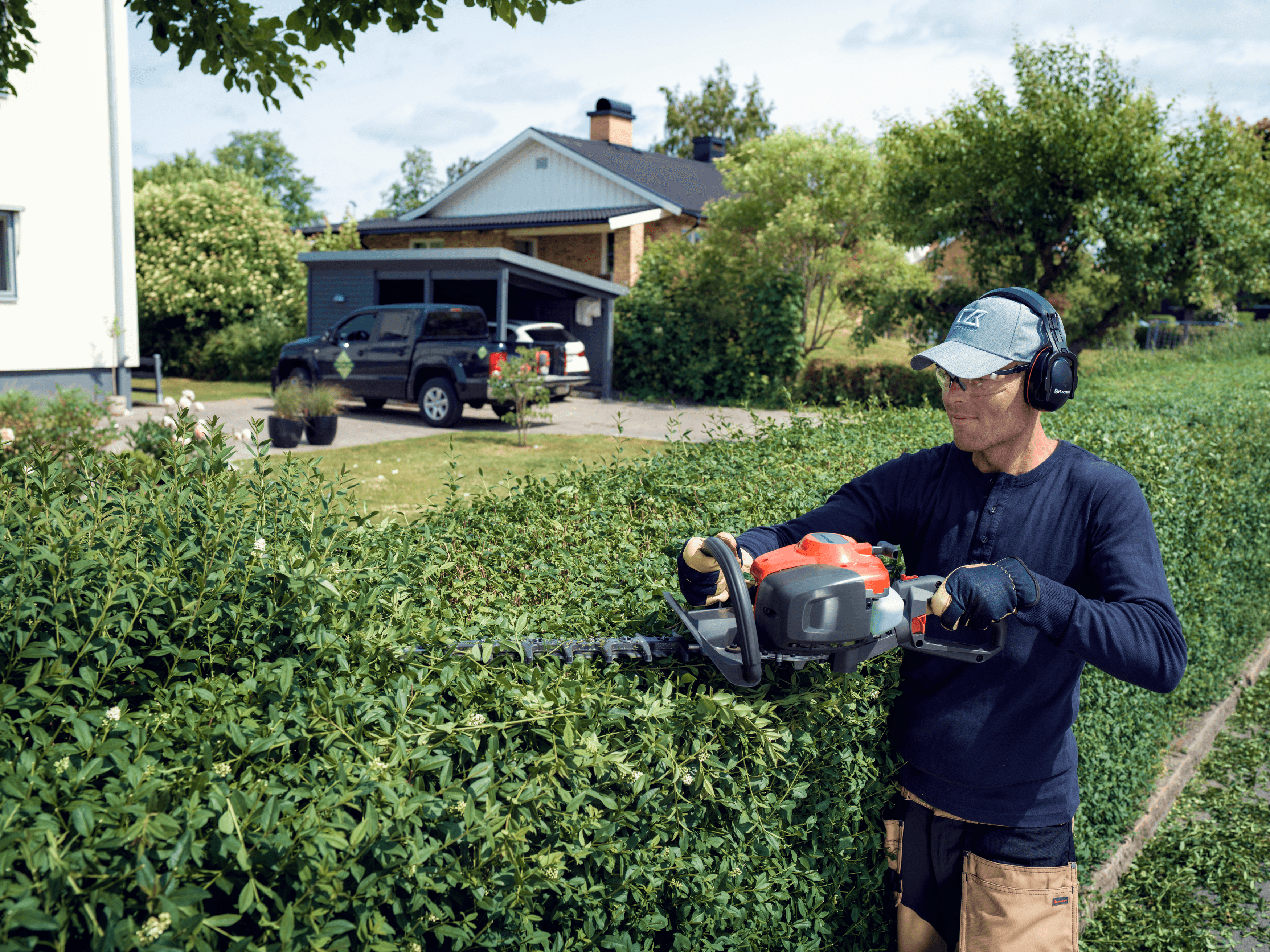 Man shaping with  Shrub Shear