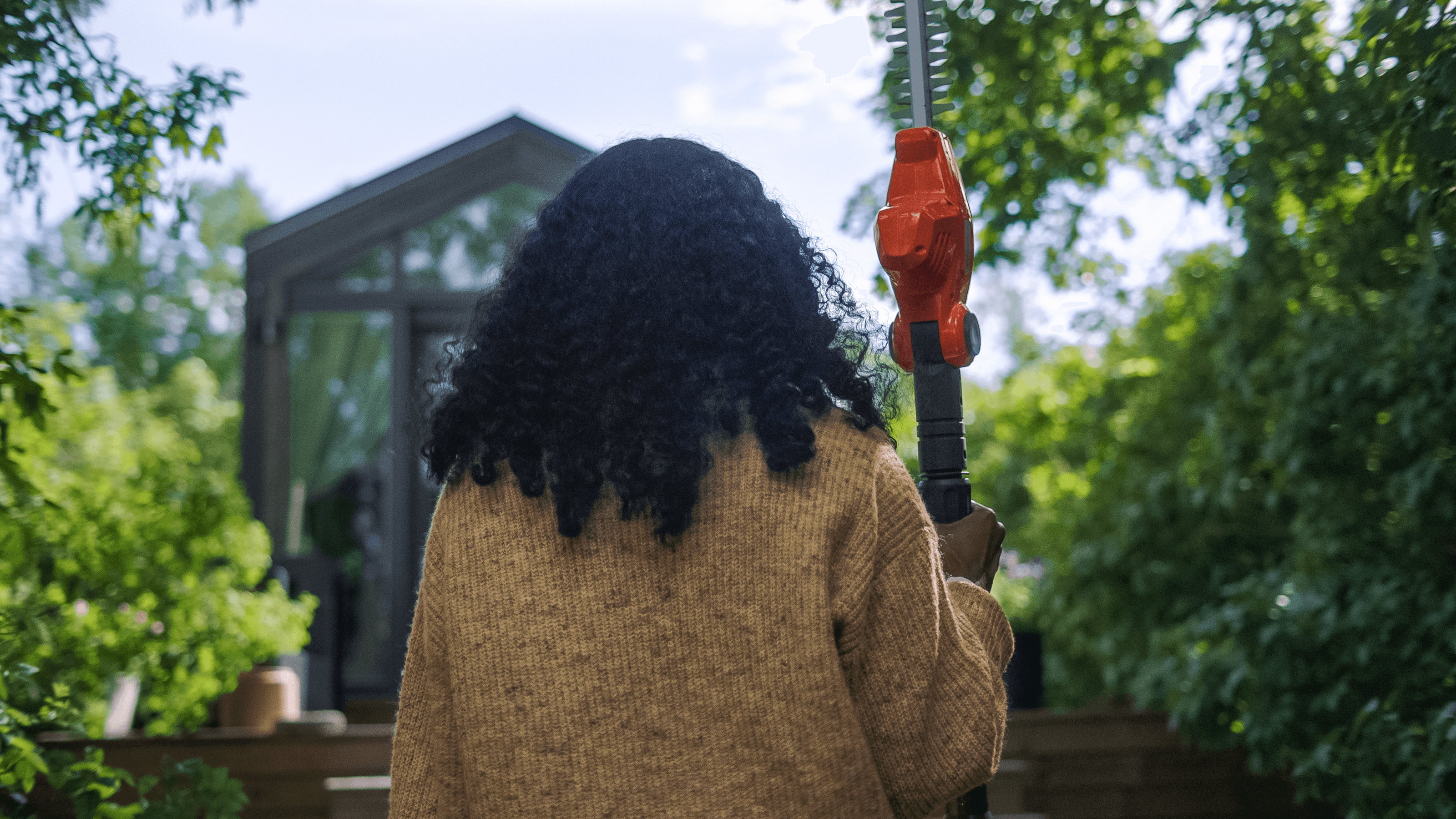 man wearing ppe with chainsaw